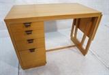 Lot 268:  EDWARD WORMLEY for DREXEL Blond 4 Drawer Desk. Drop Side. Metal pulls. Label. : Dimensions:  H: 29.5 inches: W: 41 inches: D: 23 inches --- 