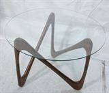 Lot 274:  Italian style Glass Top Table. Unique form wood base with brass accents. not marked: Dimensions:  H: 20 inches: W: 28 inches: D: 28 inches --- 