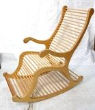 Lot 278:  Large Oversized Rocking Chair Rocker. Laminated wood frame with dowel seat and back.: Dimensions:  H: 48 inches: W: 24 inches: D: 46 inches --- 