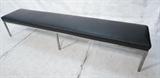 Lot 304:  KNOLL Style Long Bench. Black leather cushion on six leg square steel frame. : Dimensions:  H: 16.5 inches: W: 91 inches: D: 18 inches --- 