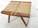 Lot 363:  Nakashima style Walnut Bench Stool. Woven Rush Seat. Angled wood Frame. Tapered peg legs. Dowel details in each corner.: Dimensions:  H: 12.5 inches: W: 18 inches: D: 16 inches --- 