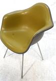 Lot 401:  EAMES Herman Miller Shell Chair. Vinyl covered fiberglass shell. Marked Herman Miller: Dimensions:  H: 32 inches: W: 24.5 inches: D: 23 inches --- 