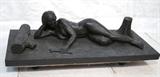 Lot 451:  EVAN D. ELLIOTT 1991 Sculpture. "The Consciousness of Humanity Dreams. The Choice of Environmentally Restorative Action or Rampant Deconstruction". Plaster Figural Nude Sculpture Painted Black: Dimensions:  H: 18 inches: W: 78 inches: D: 32 inches --- 