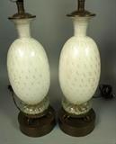 Lot 471:  Pr Murano Glass Table Lamps. White Glass with Trapped air bubbles and gold flecks. Mounted on decorative metal base. Glass is 13.5": Dimensions:  H: 31.5 inches: W: 6.5 inches --- 