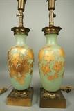 Lot 478:  Pr Green Glass Table Lamps. Gold Painted Leaf Design with White Berries. Decorative Metal Mounts. Glass is 14"H.: Dimensions:  H: 27.5 inches: W: 6 inches --- 