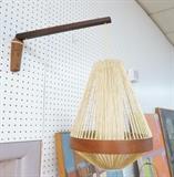 Lot 508:  Danish Modern Teak Wall Mount Lamp.  Pendant lamp with Waxed woven cord frame and teak band.  Swing arm adjustable height.: Dimensions:  H: 21 inches: W: 19.5 inches: D: 8.5 inches --- 