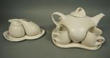 Lot 509:  Peter Saenger Tea Set.  Nesting teapot and cups on tray and nesting creamer and sugar in tray.  White.: Dimensions:  H: 7 inches: W: 10 inches: D: 9 inches --- 