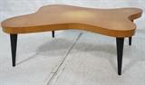 Lot 512:  Gilbert Rohde Style Coffee Cocktail Table.  Cloud Form on Tapered Ebonized Legs.  : Dimensions:  H: 16 inches: W: 43 inches: D: 32 inches --- 