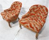 Lot 515:  Pair Decorator Lounge Chair with Low Arms.  Wood Frames.  On casters.: Dimensions:  H: 28.5 inches: W: 28 inches: D: 29.5 inches --- 