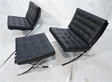 Lot 526:  3pcs Ludwig Mies van der Rohe Barcelona Style Seating.  Pair of Lounge Chairs and Ottoman.  Black leather.: Dimensions:  H: 31 inches: W: 30.25 inches: D: 31 inches --- 