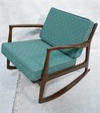 Lot 533:  Selig Danish Modern Rocking Chair.  Shaped angled back supports.  Flared arms.: Dimensions:  H: 27 inches: W: 30 inches: D: 32 inches --- 