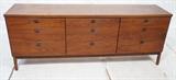 Lot 549:  American Modern Walnut Low Chest Dresser.  Baughman Style.  Black metal Pulls.  Square legs.: Dimensions:  H: 30.5 inches: W: 77.75 inches: D: 18.75 inches --- 