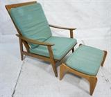 Lot 564:  Modern Lounge Chair & Ottoman. Arched Skirt. Tall Back. Pale green fabric upholstery.: Dimensions:  H: 35 inches: W: 28 inches: D: 35 inches --- 