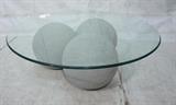 Lot 575:  Modernist Coffee Cocktail table. Three Ball Base. Beveled Glass Top. Balls are plastic. : Dimensions:  H: 15 inches: W: 42 inches: D: 42 inches --- 