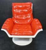 Lot 633:  DECORION Fun Furniture Plastic Lounge Chair. Red Vinyl Upholstery. Marked: Dimensions:  H: 34 inches: W: 35 inches: D: 38 inches --- 