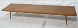 Lot 642:  Long Low Coffee Table. American Modern Wood. Brass Peg Legs. : Dimensions:  H: 12 inches: W: 72 inches: D: 18 inches --- 