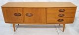 Lot 645:  Danish Modern Teak Credenza. Two Doors. Three Drawers. Large Oval Contrasting wood pulls. Square peg legs: Dimensions:  H: 30.5 inches: W: 72 inches: D: 19 inches --- 