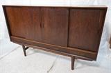 Lot 646:  Tall Rosewood Danish Modern Credenza. Four sliding doors over four drawers. Interior shelves & drawers. Mirror back bar cabinet. : Dimensions:  H: 47 inches: W: 74 inches: D: 17.5 inches --- 