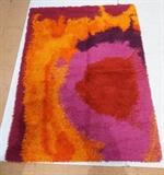 Lot 656:  Colorful Shag Rug Carpet. Reds, Oranges & Purples. Not marked: Dimensions:  H: 67 inches: W: 56 inches --- 