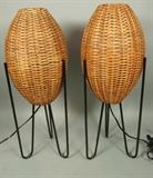 Lot 674:  Pr Woven PAUL MAYAN Table Lamps. Black Iron Hairpin Legs. Woven rattan egg form shades.: Dimensions:  H: 27 inches: W: 10 inches: D: 10 inches --- 
