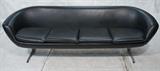 Lot 693:  Overman Black Vinyl Sofa Couch. Four Seater. Metal Legs & Feet: Dimensions:  H: 27 inches: W: 90 inches: D: 34 inches --- 