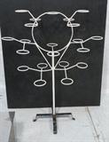 Lot 702:  FREDRICK WEINBERG style Painted Iron Plant Stand. 21 Arm Outdoor Patio Stand. Two part.: Dimensions:  H: 51 inches: W: 45 inches: D: 23 inches --- 