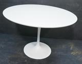 Lot 717:  KNOLL Eero SAARINEN Tulip Dining Table. Round White Laminate Top: Dimensions:  H: 28 inches: W: 42 inches: D: 42 inches --- 