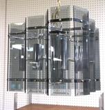 Lot 725:  Modernist Smoked Glass Panel Hanging Light Chandelier. Chrome frame.: Dimensions:  H: 16 inches: W: 20 inches: D: 22 inches --- 