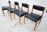 Lot 733:  4 Modernist  Dining Chairs.  Teak with black vinyl upholstery.  Made in Romania: Dimensions:  H: 30.5 inches: W: 19.5 inches: D: 20 inches --- 