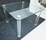 Lot 739:  Glass Top Square Dining Table. Thick Lucite Column Legs with metal caps. 3/4" thick glass top. : Dimensions:  H: 28.75 inches: W: 42 inches: D: 42 inches --- 