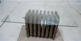 Lot 747:  Industrial Radiator Base Glass Top Coffee Table. Silver painted radiator. Rectangle Glass Top. : Dimensions:  H: 16.5 inches: W: 36 inches: D: 24 inches --- 