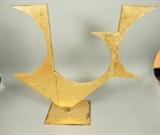 Lot 756:  Heavy welded steel sculpture. Painted Gold. Marked MG: Dimensions:  H: 26 inches: W: 27 inches: D: 8 inches --- 