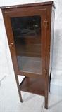 Lot 778:  Vintage Metal Medical Cabinet. Raised on legs with lower shelf. Painted brown.: Dimensions:  H: 60.75 inches: W: 20 inches: D: 15.5 inches --- 