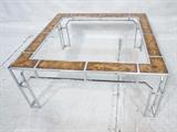 Lot 780:  MILO BAUGHMAN Chrome Asian Inspired Coffee Table. Burled Wood panels in thin square tube frame. Square Cocktail Table: Dimensions:  H: 16.25 inches: W: 36 inches: D: 36 inches --- 