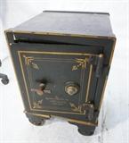 Lot 785:  Vintage Antique Iron Safe. KEENAN SAFE CO. Broadway, NY. Black with gold painted decoration. Marked.: Dimensions:  H: 24.5 inches: W: 16.5 inches: D: 19 inches --- 