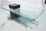 Lot 798:  Modernist Chrome Glass Coffee Table. Bi level glass tops with black wood supports and flat rod chrome base.: Dimensions:  H: 14 inches: W: 41.5 inches: D: 23.5 inches --- 
