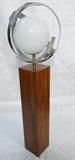 Lot 829:  LAUREL Floor Lamp. Square Wood Pedestal with Aluminum Spherical detail. Glass Shade: Dimensions:  H: 60 inches: W: 18 inches: D: 18 inches --- 
