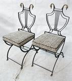 Lot 830:  Pr Black Iron Regency style Side Chairs. Decorator style with brass swan finials and paw feet. : Dimensions:  H: 37 inches: W: 15 inches: D: 16 inches --- 