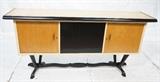 Lot 832:  European Modern 3 door Credenza. Trestle wavy base. Ebonized band and one ebonized cabinet. Brass handles.: Dimensions:  H: 38 inches: W: 76 inches: D: 20 inches --- 