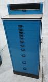 Lot 847:  Small Art Deco Blue Wood Dental Medical Cabinet. Black trim & drawer pulls. Linen Formica lift top. Eleven drawers. Ruby Dental Manufacturing Co: Dimensions:  H: 49 inches: W: 20.5 inches: D: 14 inches --- 