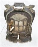 Lot 852:  Ornate French Cast Iron Stove Heater. Dragon design. Shale Front. LA SALAMANDRE. E. CHABOCHE. Model Louis. Porcelain handles. : Dimensions:  H: 29 inches: W: 26 inches: D: 15 inches --- 