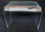 Lot 857:  Modernist Lucite Vanity. Silver Mirrored Tape details.: Dimensions:  H: 30 inches: W: 40 inches: D: 19 inches --- 
