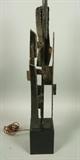 Lot 874:  Tall Narrow Brutalist HARRY BAUMER Sculptural Metal Table Lamp. Steel LAUREL Lamp: Dimensions:  H: 50 inches: W: 6 inches: D: 7 inches --- 