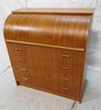 Lot 885:  Danish Teak Roll Top Desk. Fitted desk interior with three drawers. Four drawers with recessed wood pulls. Pull out : Dimensions:  H: 38 inches: W: 35 inches: D: 19 inches --- 