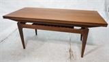 Lot 891:  Danish Teak Convertible Extension Coffee Table. Top lifts up and sides pull out. Extension Cocktail Table. Each retractible leaf is 8": Dimensions:  H: 21 inches: W: 48 inches: D: 21 inches --- 