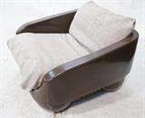 Lot 905:  Italian Brown Molded Plastic Lounge Chair. Sits on four large ball feet. One upholstered sling cushion. Marked AMPAFORM Italy. : Dimensions:  H: 24 inches: W: 33 inches: D: 31 inches --- 