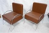 Lot 906:  Pr Oversized Brown Leather Lounge Chairs. Chrome tube frames. Woven look brown leather: Dimensions:  H: 38 inches: W: 27 inches: D: 29 inches --- 