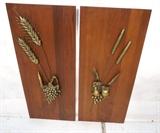 Lot 939:  Pair American Modern Wall Plaques.  Brass tone metal on walnut.  Fruit and cattails.  : Dimensions:  H: 42 inches: W: 18 inches --- 