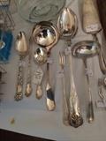 Some of the many pieces of sterling & silver plate