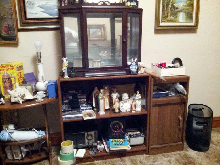 religious statues, bookcases, tables and small curio